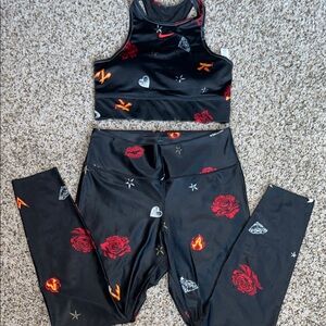Nike Black Crop Top (M) & Leggings (L) with Red and Orange Accents.